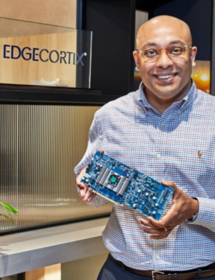 EdgeCortix Founder and CEO Dr. Sakyasingha Dasgupta holds a board equipped with the company's proprietary SAKURA-I AI Processor