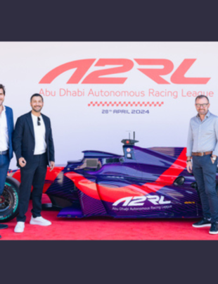 The ASPIRE team took a group photo with the newly unveiled self-driving Super Formula SF23 car in Abu Dhabi (Photo: AETOSWire)