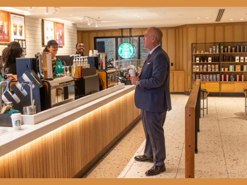 University of Tulsa President Brad R. Carson picks up his order and visits with the staff at Oklahoma's largest Starbucks, which opened on the main floor of McFarlin Library on Nov. 1, 2023.