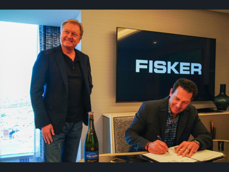 Fisker-CEO-Henrik-Fisker-and-Mike-Domenicone-Principal-and-owner-of-Classic-Fisker-signing-at-NADA-in-Las-Vegas.-Photo-Fisker-Inc