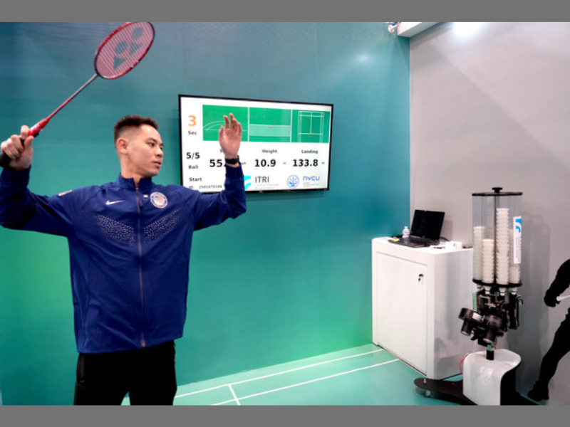 US badminton Olympian Howard Shu plays with ITRI's AI Badminton Trainer at CES 2025