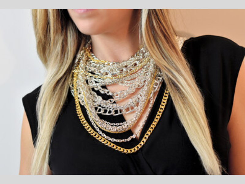 Ren Jord 999 Pure Silver and 24K Pure Gold Chains on a female model (Photo Courtesy: PRNewswire)