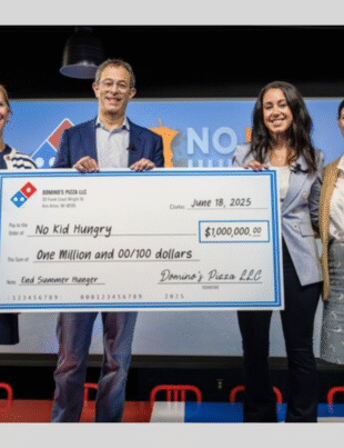 Domino’s has made a three-year, $1 million commitment to No Kid Hungry to help expand summer meal access for kids across the U.S. Pictured, from left to right: Maureen Pittenger, Domino’s EVP-chief human resources officer; Russell Weiner, Domino’s CEO; Sara Jamshidi, Share Our Strength senior director of corporate partnerships; and Jeannette Sharp, Domino’s manager of community relations (Image Courtesy: PRNewswire)