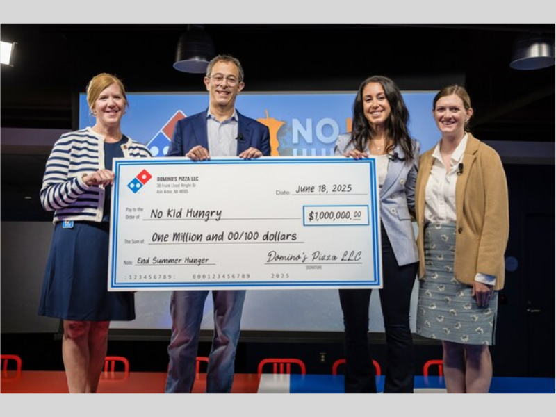 Domino’s has made a three-year, $1 million commitment to No Kid Hungry to help expand summer meal access for kids across the U.S. Pictured, from left to right: Maureen Pittenger, Domino’s EVP-chief human resources officer; Russell Weiner, Domino’s CEO; Sara Jamshidi, Share Our Strength senior director of corporate partnerships; and Jeannette Sharp, Domino’s manager of community relations (Image Courtesy: PRNewswire)