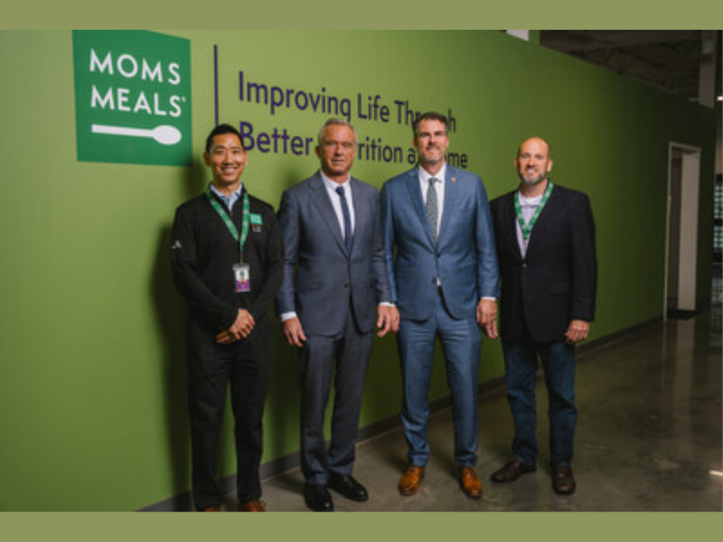 L to R: Mom's Meals CEO Chris Choi, HHS Secretary Robert F. Kennedy, Jr., Oklahoma Governor Kevin Stitt, Mom's Meals COO Dan Mandolfo (Photo Courtesy: PRNewswire)