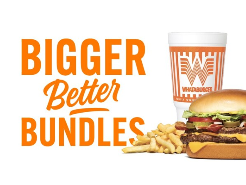 Whataburger meal featuring a cheeseburger with lettuce, tomato, pickles, and onions, served with fries and a large drink in a branded cup. Bold orange text on the left reads 'Bigger Better Bundles (Image Courtesy: PRNewswire)