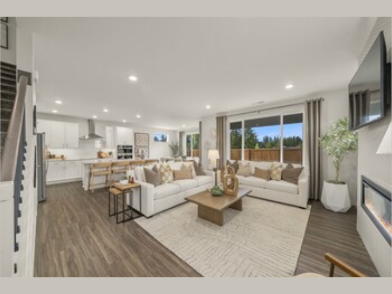 Caymen Model Great Room New Construction Homes in Puyallup, WA Heritage Heights by Century Communities (Image Courtesy: PRNewswire)