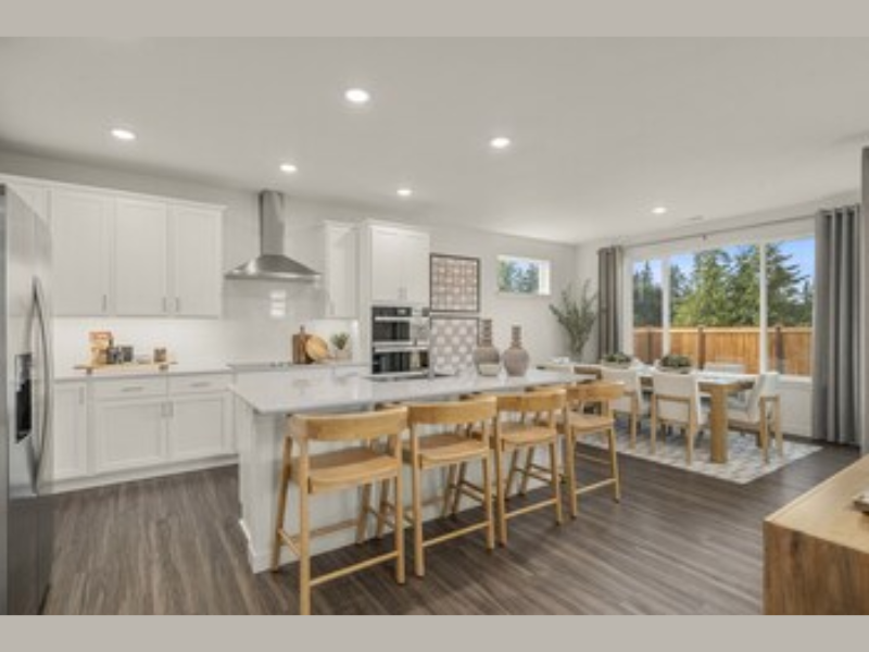 Caymen Model Kitchen New Homes for Sale in Puyallup, WA Heritage Heights by Century Communities (Image Courtesy: PRNewswire)