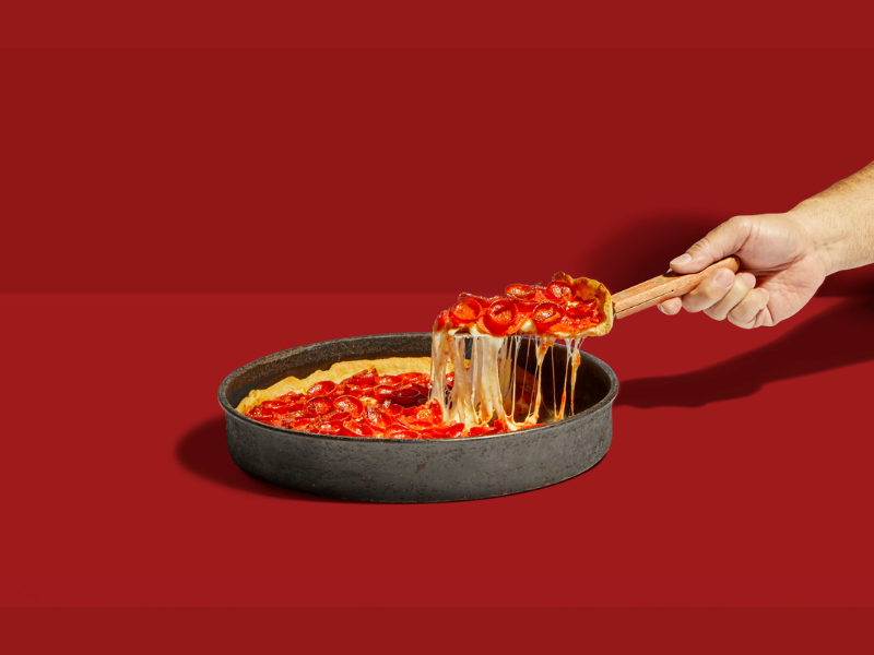 Chicago pizzeria debuts pepperoni-packed pizza during National Pizza Week featuring three layers, three flavors and three pepperoni styles (Image Courtesy: PRNewswire)
