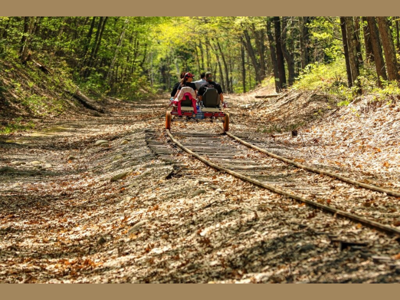 Woodsy Rail Bike Adventure (Image Credit: PRNewswire)