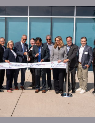 Ribbon cutting at the Grand Opening of AtomVie Global Radiopharma's new purpose-built radiopharmaceutical manufacturing facility in Hamilton, Ontario (Image Courtesy: PRNewswire)